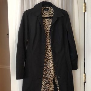 Black trench coat.  5 buttons.